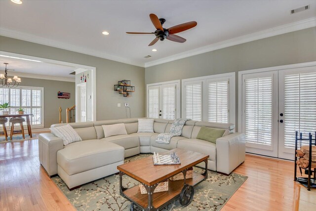 5407 Kiokee Ridge Rd, Evans, GA 30809 - living area with crown molding, light wood-style floors, french doors, ceiling fan with notable chandelier, and recessed lighting