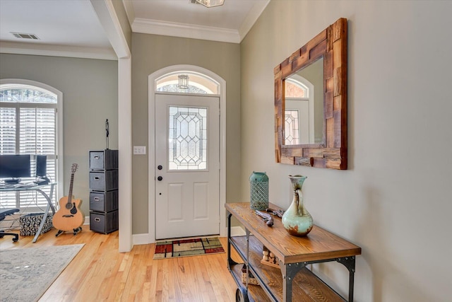 5407 Kiokee Ridge Rd, Evans, GA 30809 - entryway featuring baseboards, visible vents, ornamental molding, and light wood-style flooring