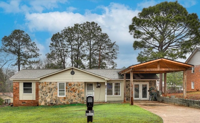 single story home with a carport, a front lawn, and french doors