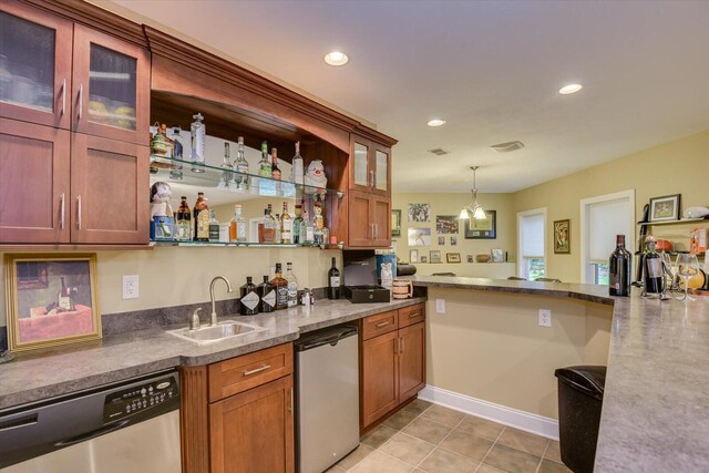 bar with dishwasher, light tile patterned floors, sink, and decorative light fixtures