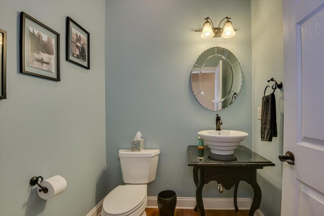 bathroom with sink and toilet