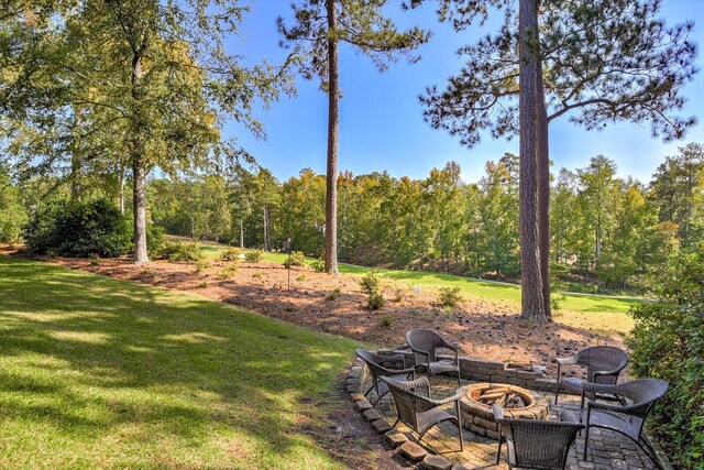 view of yard with an outdoor fire pit