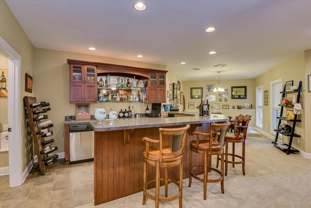 bar with dishwasher, decorative light fixtures, a chandelier, and light colored carpet