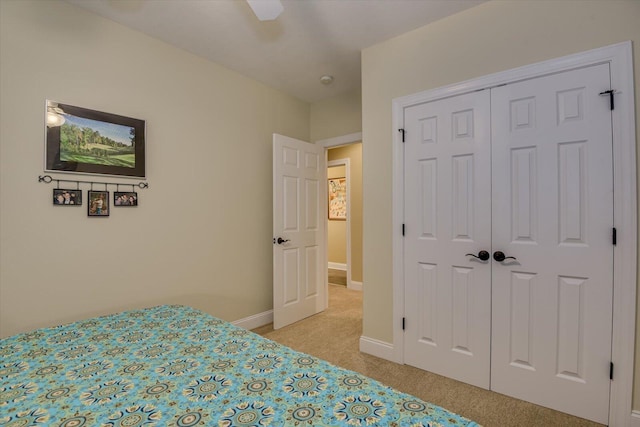 unfurnished bedroom with a closet, ceiling fan, and light colored carpet