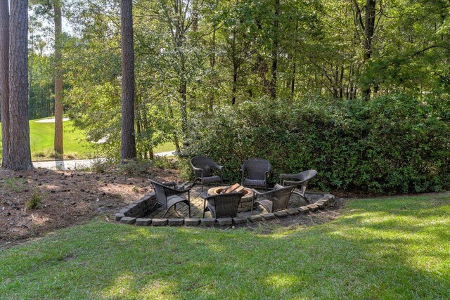 view of yard with an outdoor fire pit