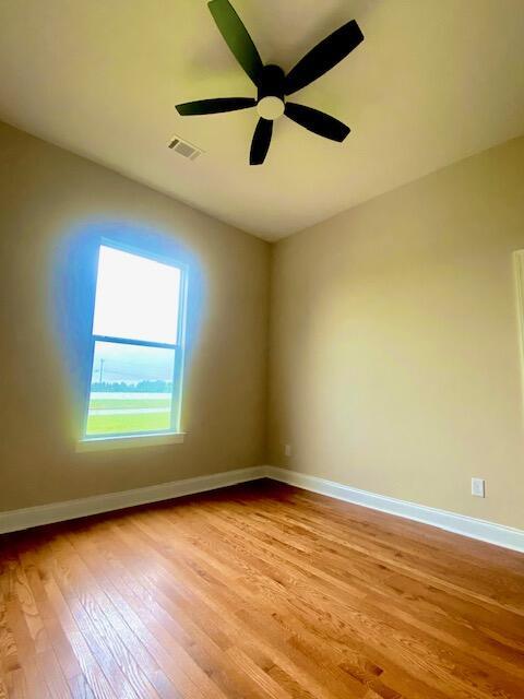 2016 Elite Ct, Hephzibah, GA 30815 - empty room featuring light wood finished floors, baseboards, and a ceiling fan