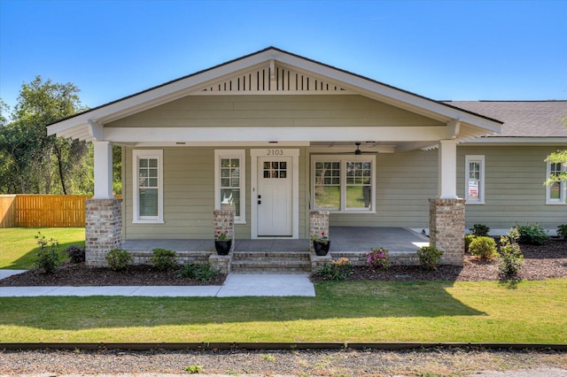 view of front of property with a front yard and a porch