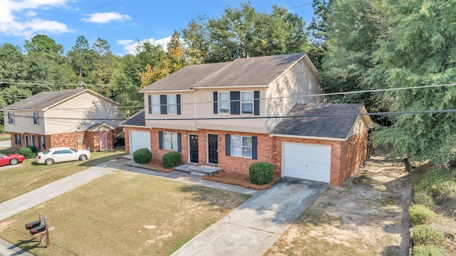 view of front of home with a front lawn and a garage