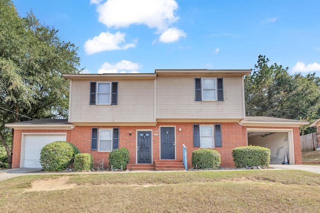 view of front of property featuring a front yard and a garage