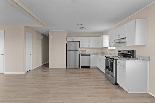 kitchen with light wood-type flooring, under cabinet range hood, white cabinetry, and stainless steel appliances