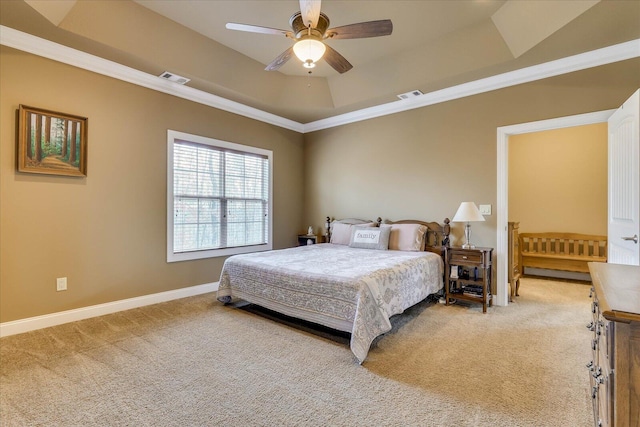 bedroom featuring crown molding, a raised ceiling, ceiling fan, and carpet