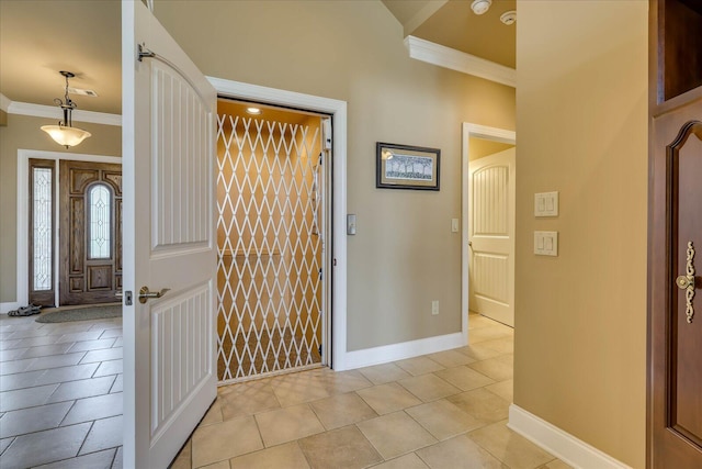 tiled entrance foyer with ornamental molding