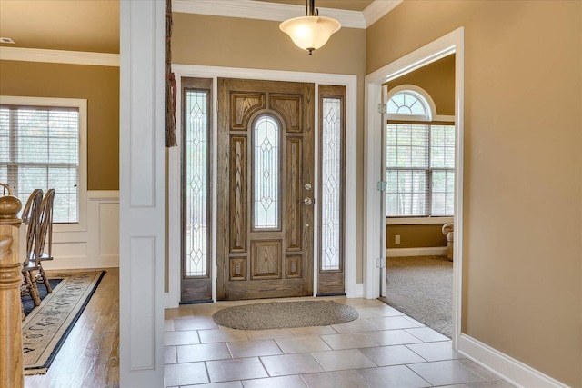 foyer featuring ornamental molding