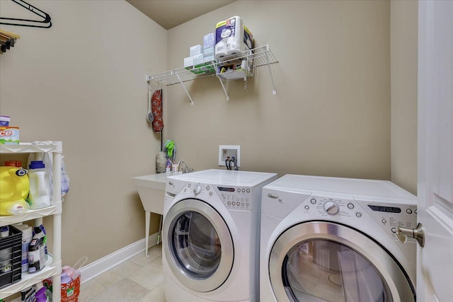 clothes washing area featuring washing machine and clothes dryer