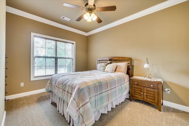 carpeted bedroom featuring ornamental molding and ceiling fan