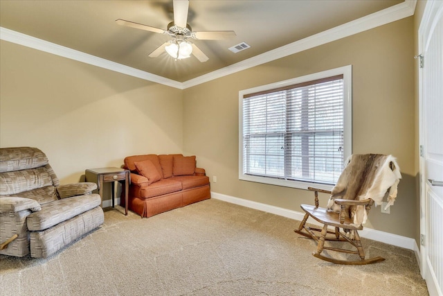 living area with crown molding, light carpet, and ceiling fan