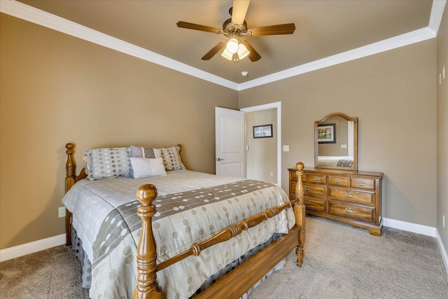 bedroom featuring ornamental molding, light colored carpet, and ceiling fan