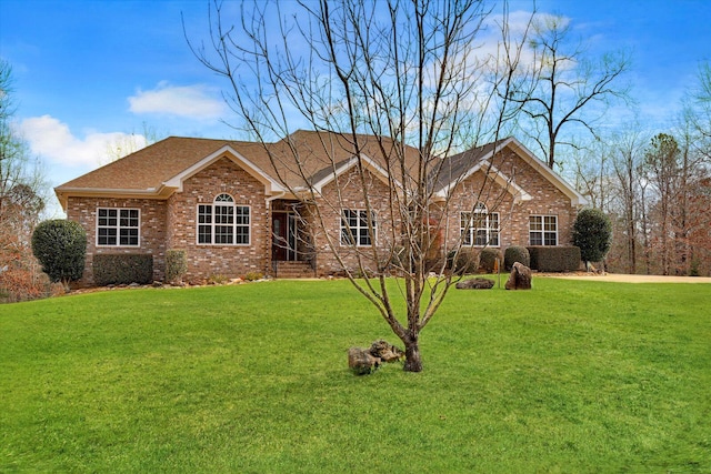 single story home featuring a front yard