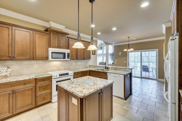 kitchen with sink, a center island, kitchen peninsula, pendant lighting, and white appliances