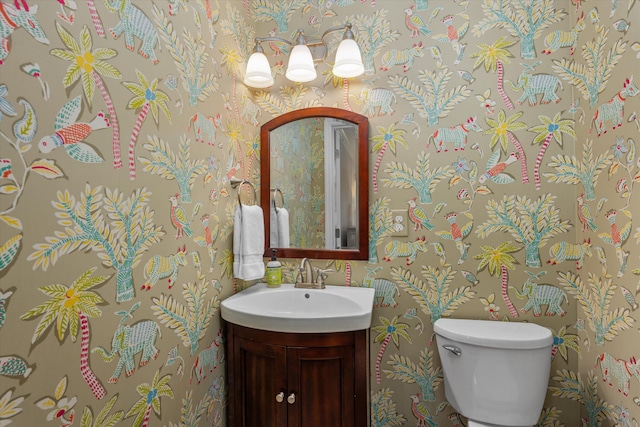748 Mcclure Dr, Augusta, GA 30909 - half bath with vanity, wallpapered walls, and a chandelier