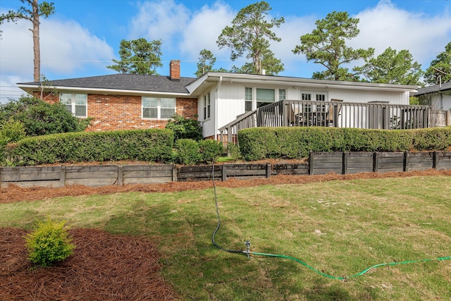 748 Mcclure Dr, Augusta, GA 30909 - ranch-style house with a chimney, brick siding, a front yard, and a deck