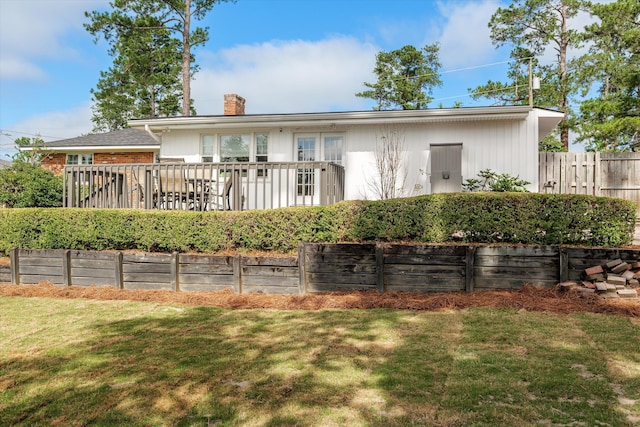 748 Mcclure Dr, Augusta, GA 30909 - back of property with a chimney and a wooden deck