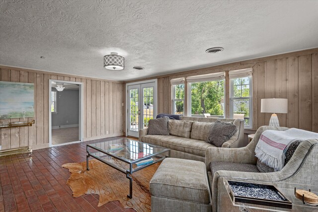 748 Mcclure Dr, Augusta, GA 30909 - living room with wooden walls, brick floors, and a textured ceiling
