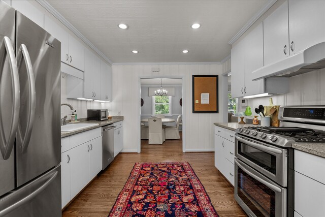 748 Mcclure Dr, Augusta, GA 30909 - kitchen with appliances with stainless steel finishes, ornamental molding, under cabinet range hood, recessed lighting, and light countertops