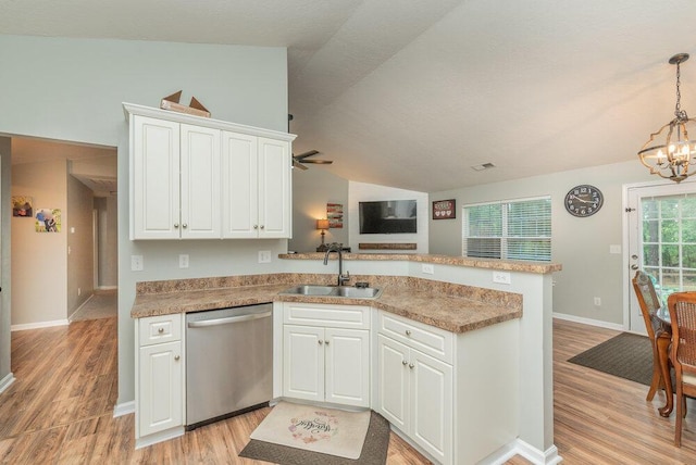 510 Sweet Meadow Dr, Grovetown, GA 30813 - kitchen with stainless steel dishwasher, a sink, a peninsula, light wood-type flooring, and lofted ceiling