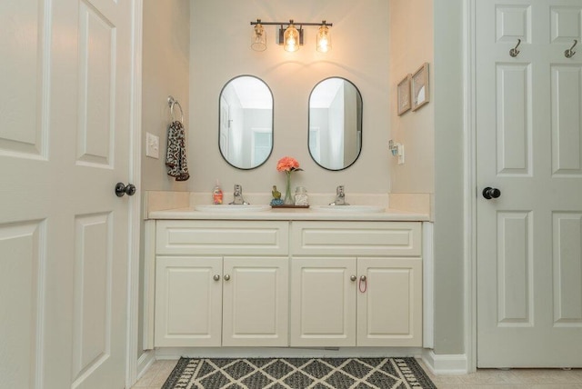 510 Sweet Meadow Dr, Grovetown, GA 30813 - bathroom with double vanity, tile patterned flooring, and baseboards