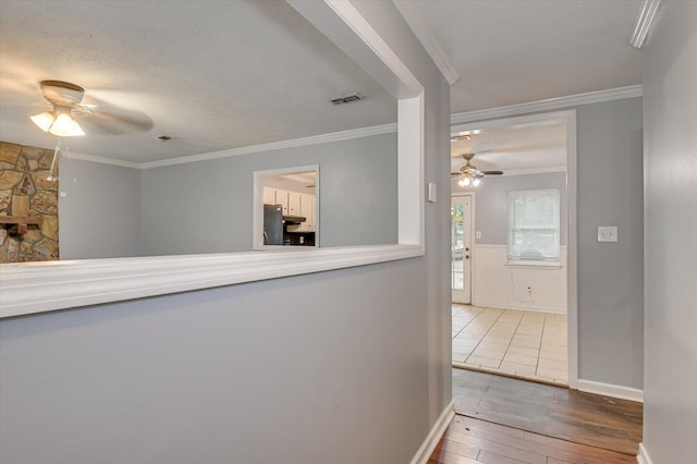 hallway with crown molding and wood-type flooring