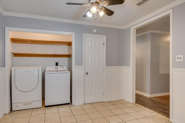 laundry area featuring separate washer and dryer, crown molding, ceiling fan, and light tile patterned flooring