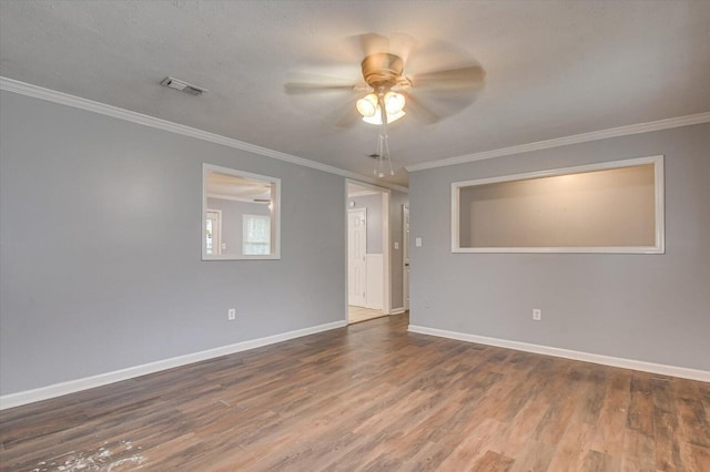 unfurnished room with wood-type flooring, ceiling fan, and crown molding