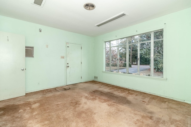 empty room with light colored carpet