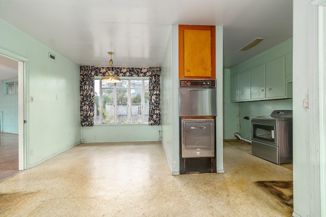 kitchen with washing machine and clothes dryer