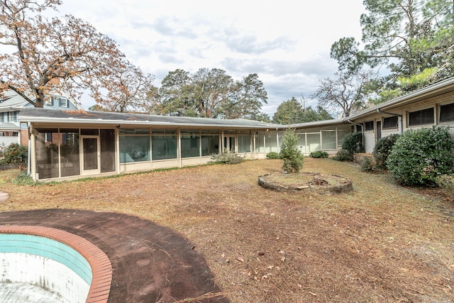 back of house with a sunroom