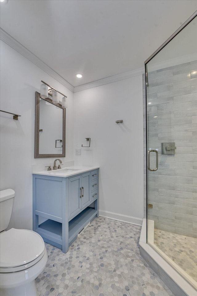 full bath with toilet, vanity, baseboards, a shower stall, and crown molding