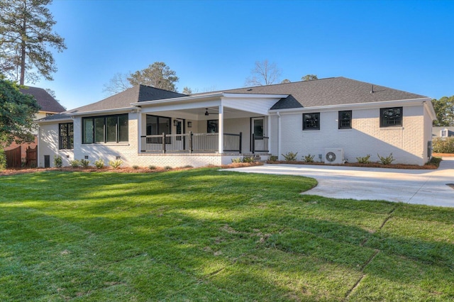 ranch-style house with brick siding, covered porch, a ceiling fan, a front yard, and crawl space