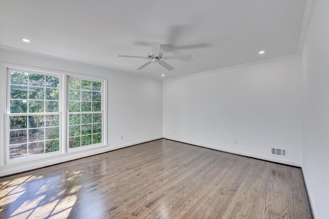 empty room with recessed lighting, visible vents, baseboards, and wood finished floors