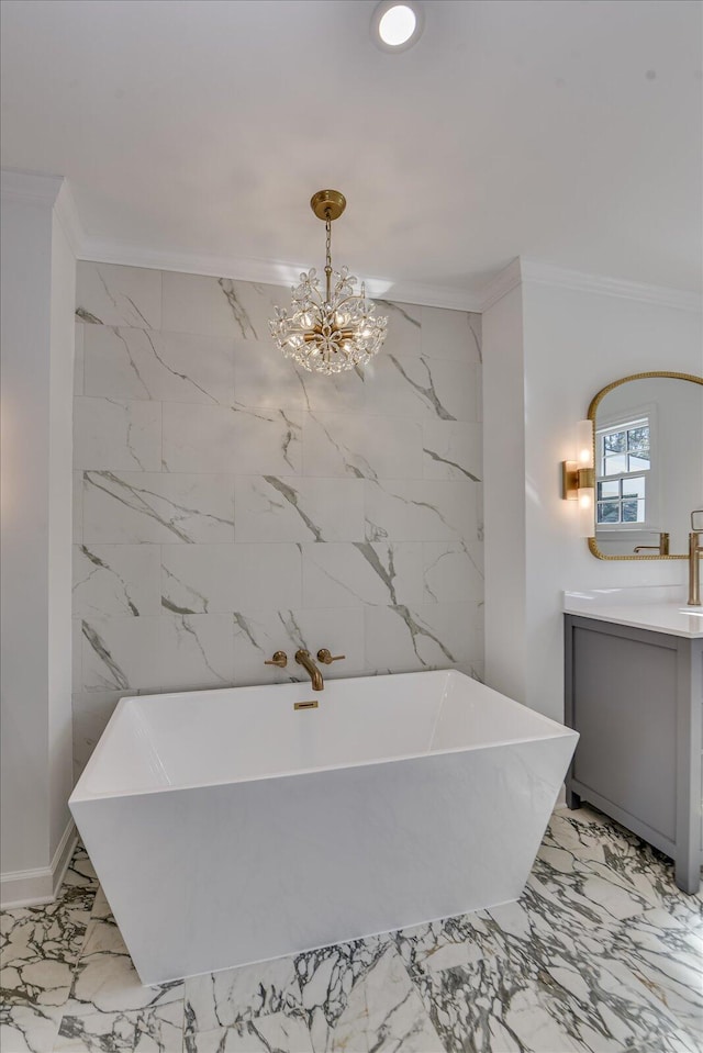 full bath with marble finish floor, vanity, and crown molding