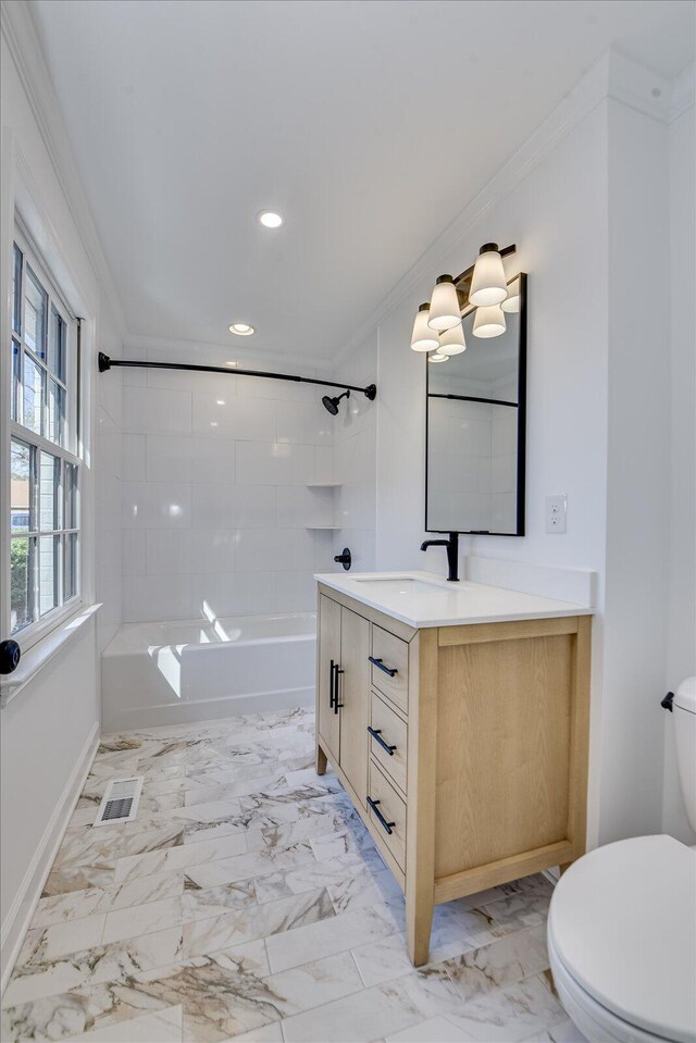 bathroom with marble finish floor, visible vents, crown molding, and toilet