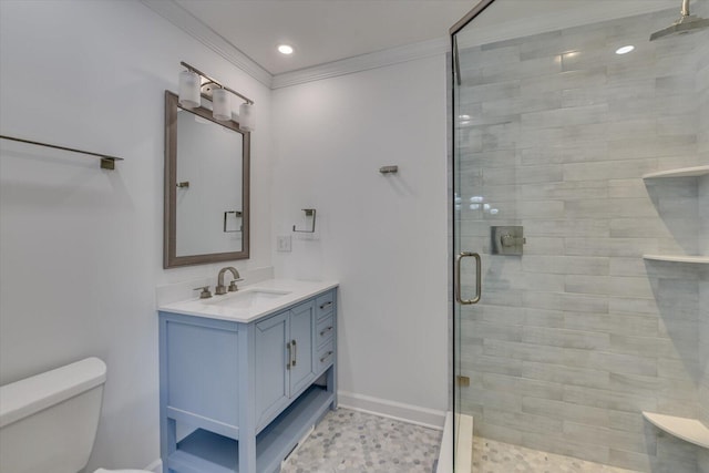 bathroom featuring toilet, recessed lighting, vanity, a shower stall, and crown molding