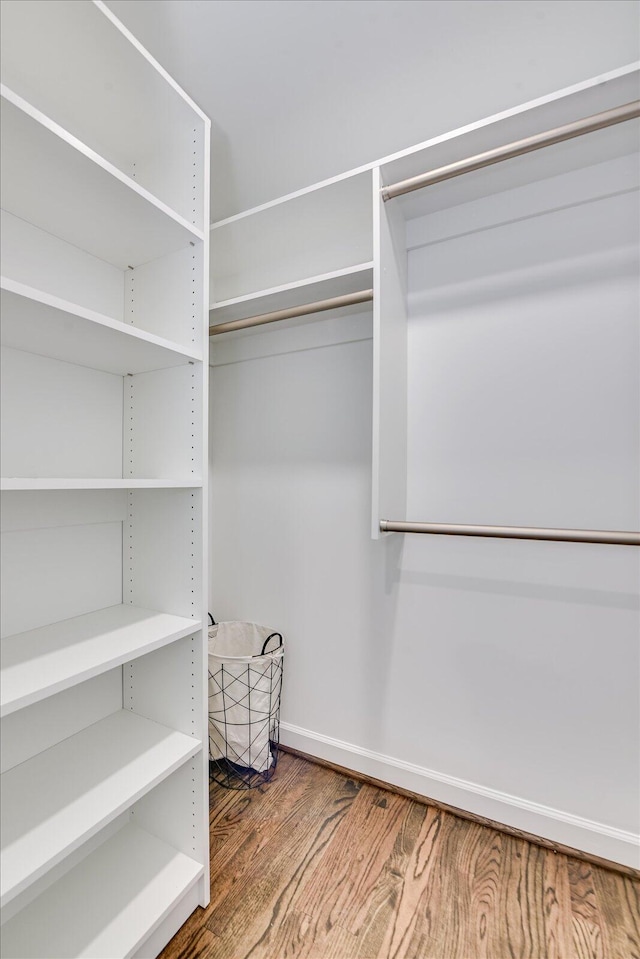 spacious closet with wood finished floors