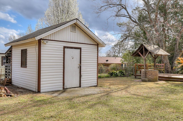 view of shed with fence