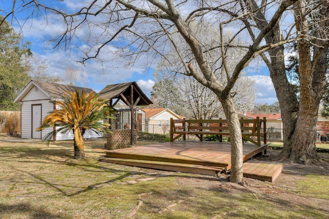 view of yard with a shed, an outdoor structure, and a deck