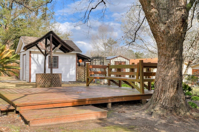 deck featuring an outdoor structure