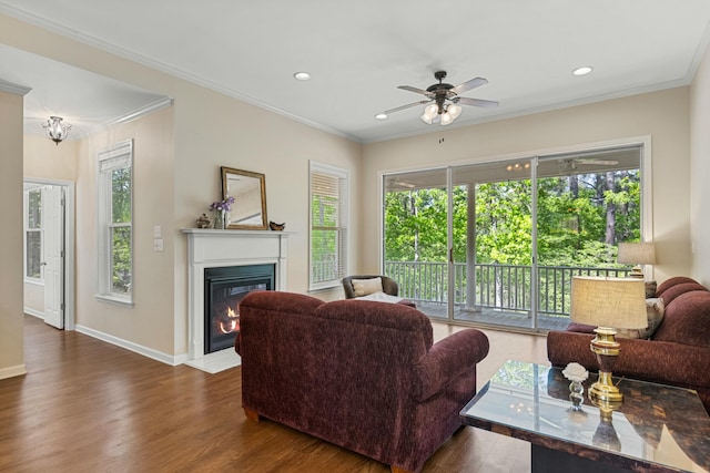 9 Caravel Cir, Mccormick, SC 29835 - living room with a fireplace with flush hearth, wood finished floors, a ceiling fan, crown molding, and recessed lighting