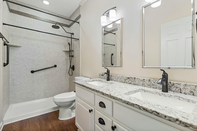 9 Caravel Cir, Mccormick, SC 29835 - bathroom featuring toilet, double vanity, wood finished floors, and tiled shower