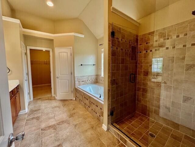 603 Yonto Dr, Grovetown, GA 30813 - full bath with a stall shower, a garden tub, vanity, a spacious closet, and lofted ceiling