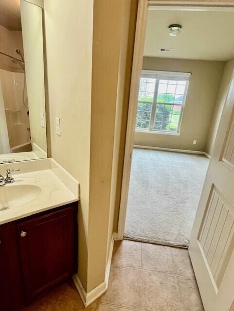 603 Yonto Dr, Grovetown, GA 30813 - bathroom with vanity, a shower, and baseboards